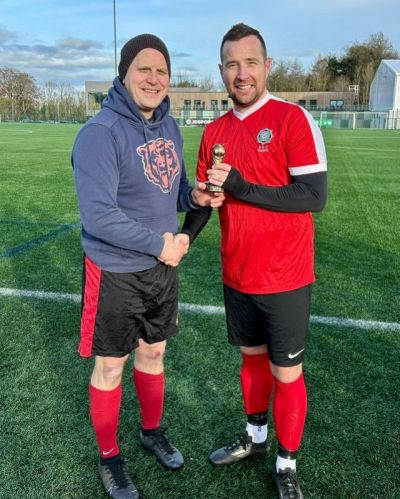 Stevie Lawson receiving his McDowell Cup  *Man of the Match* trophy from League President Gary Busch